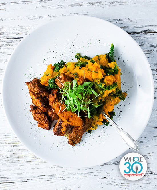 A plate of Blackened Chicken with Sweet Potato and Kale